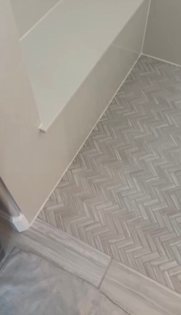100 percent white silicone bead at shower floor wall connection