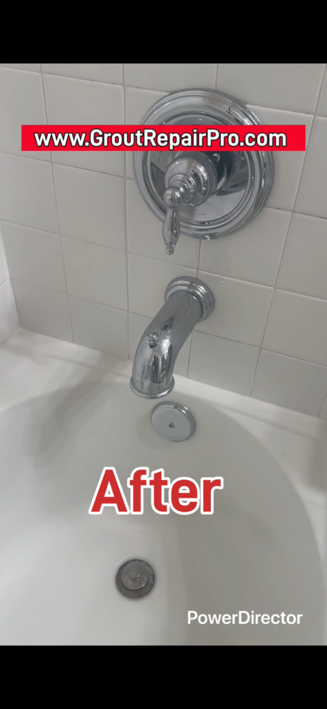 Epoxy-grout repair at tile and tub intersection in a restored shower enclosure.