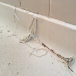 molly caulk removal at base of shower