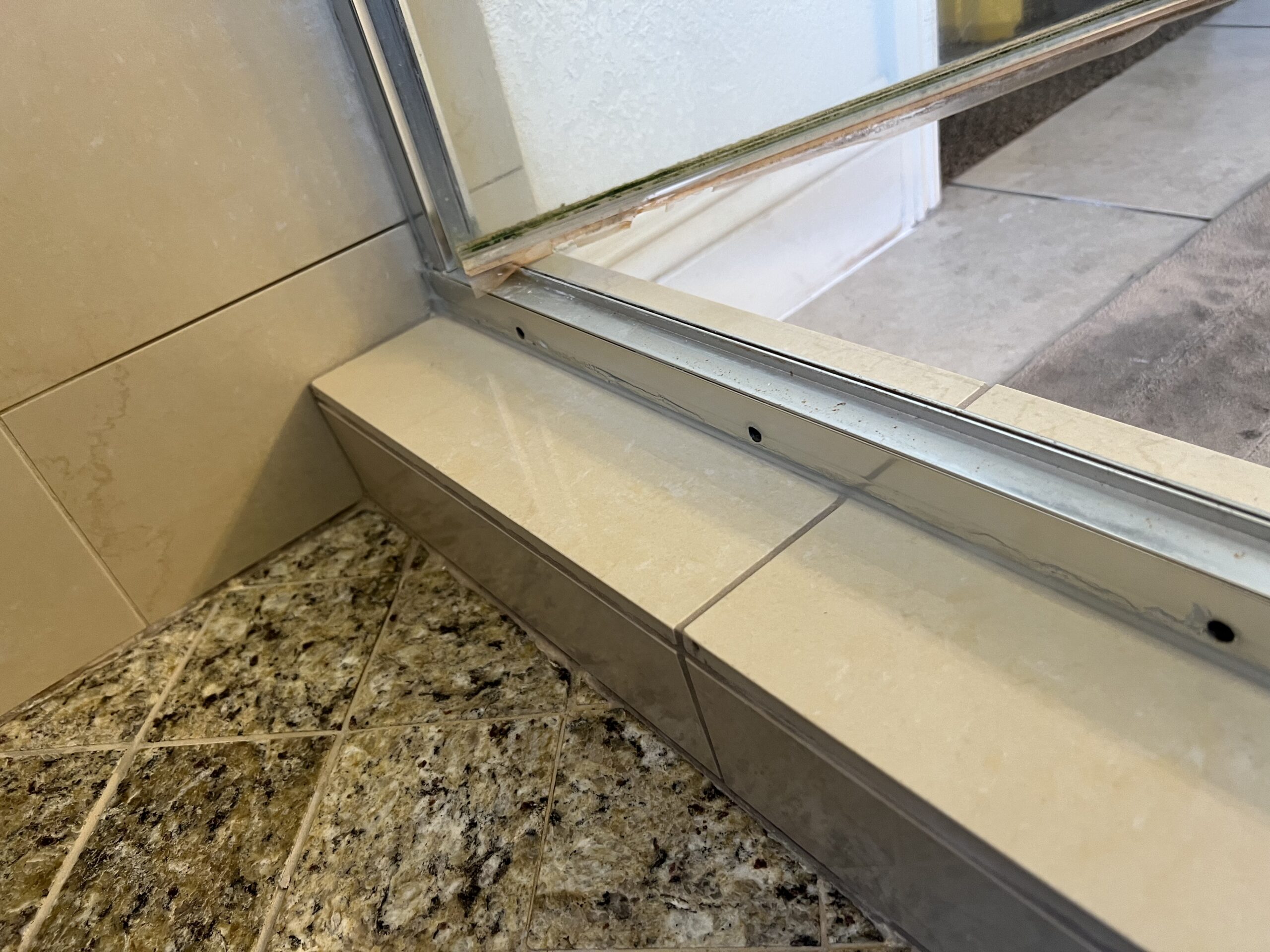 Grout lines scraped out and cleaned, prepping for fresh material