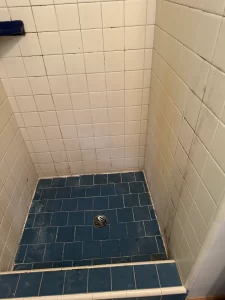 Shower floor grout issues and rusted drain screws