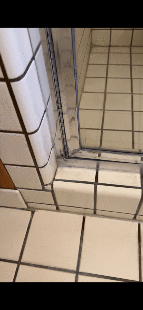 leaky glass enclosure with faulty silicone was allowing water to get outside shower