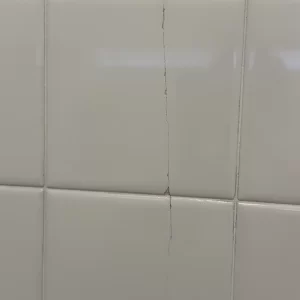 Structural crack running down back tile wall
