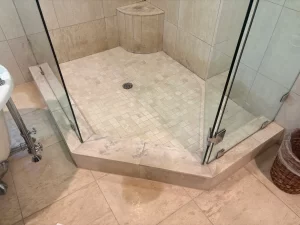 Michelle Baime natural stone shower restoration results by Grout Repair Pro